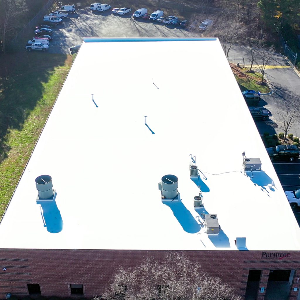 An aerial view of a completed flat roof. 