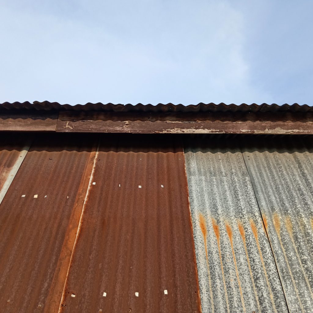 A rusty metal roof that may be in need of a coating.